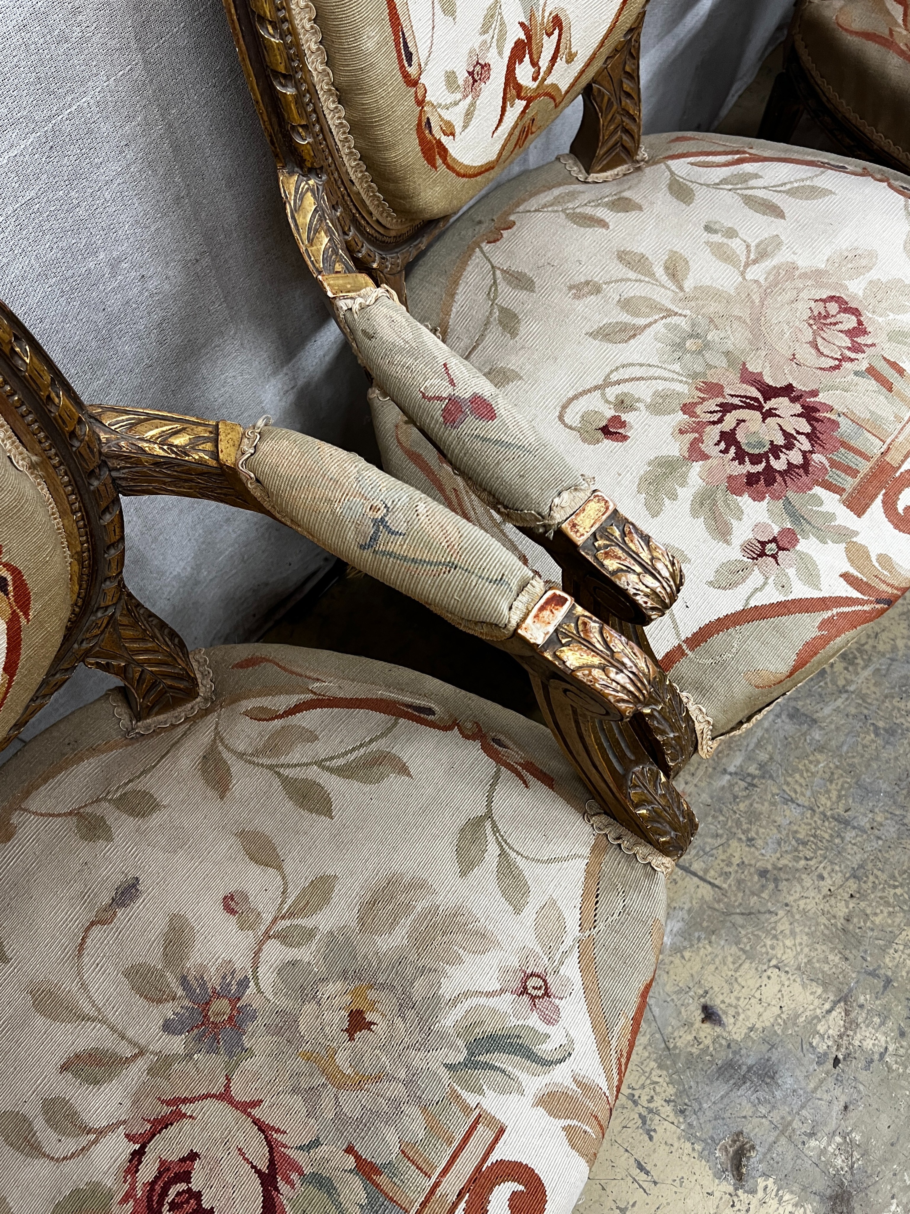 A Louis XVI style carved giltwood five piece salon suite, settee length 123cm, height 95cm